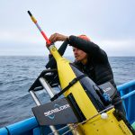 Tyler Rohr readies a Caltech Seaglider for deployment. 📷 Robert Strzepek